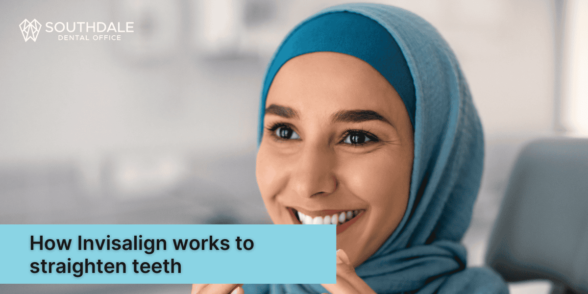 Happy patient admiring Invisalign trays during underbite consultation